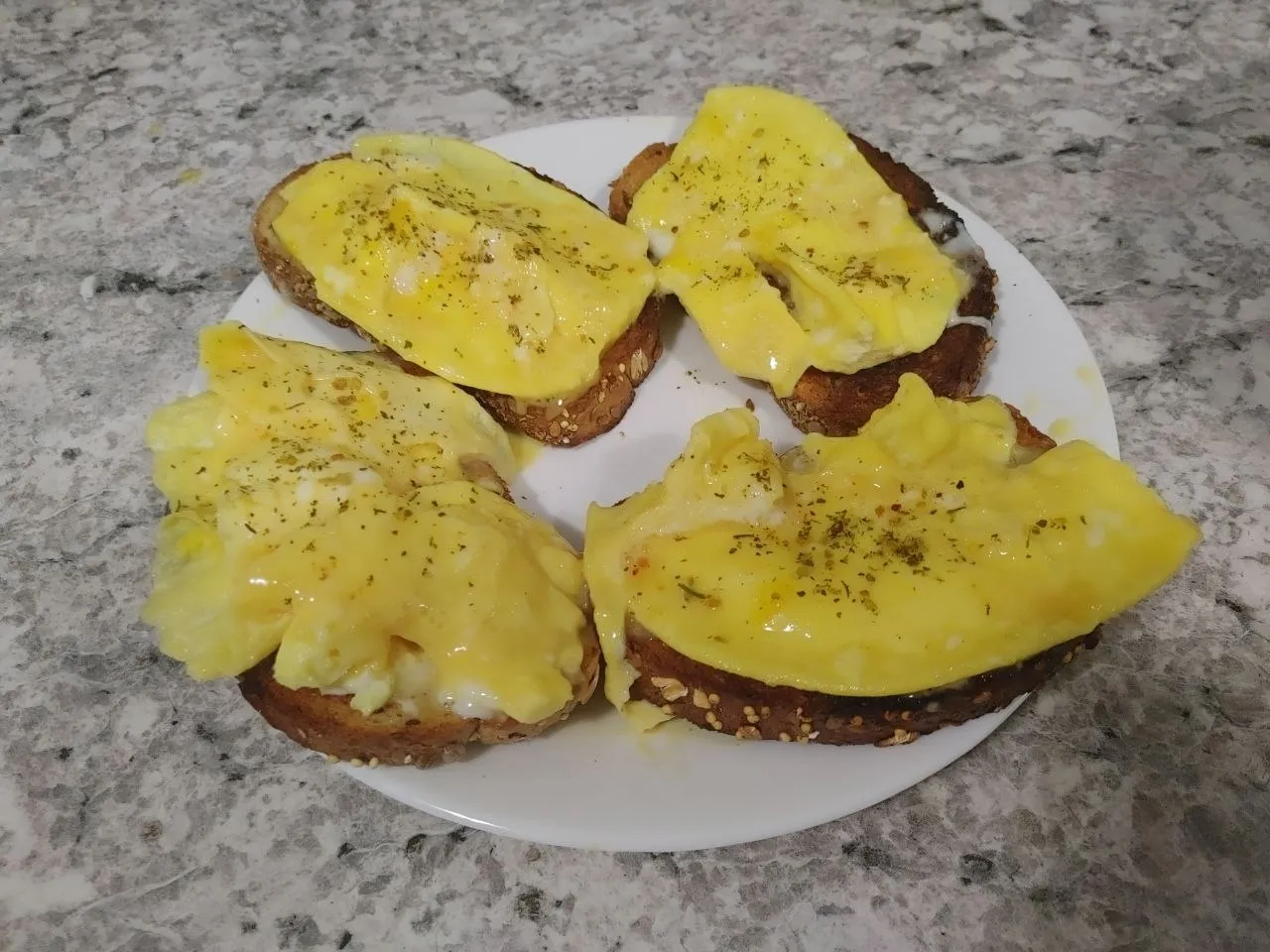 Eggs and olive oil on sourdough. Ninety seconds in the microwave.